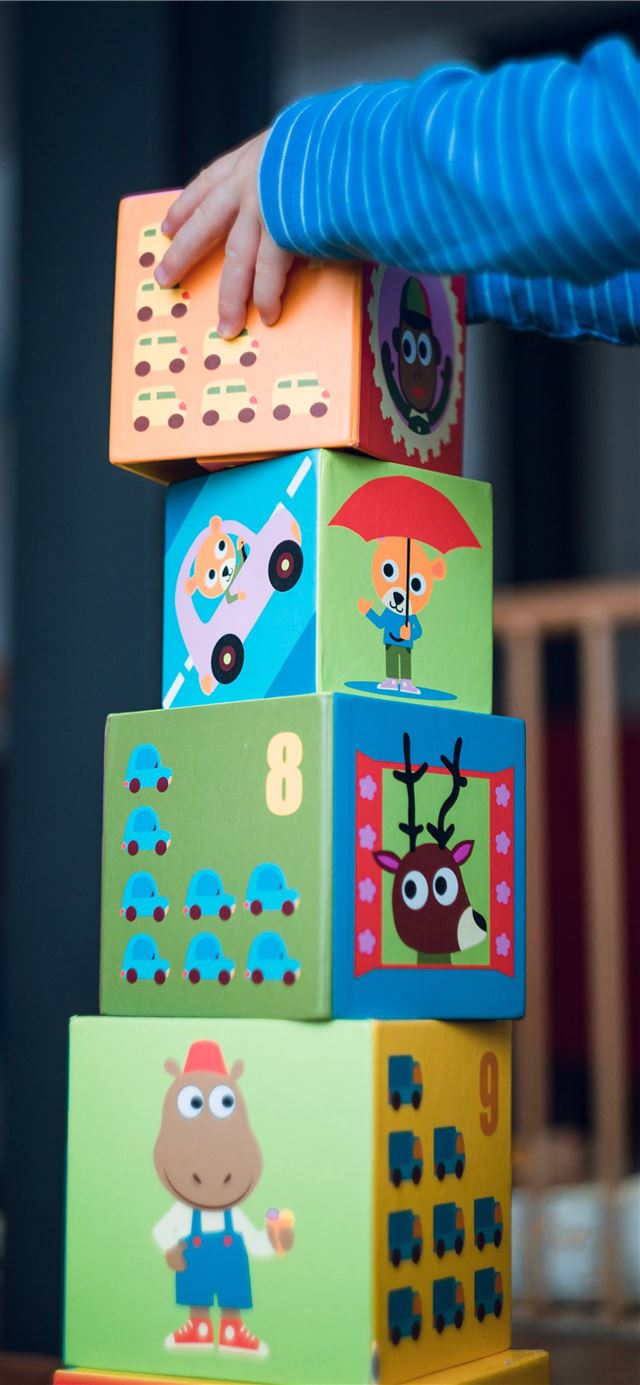 1125x2436 child building an four boxes -  iPhone 11 Wallpaper