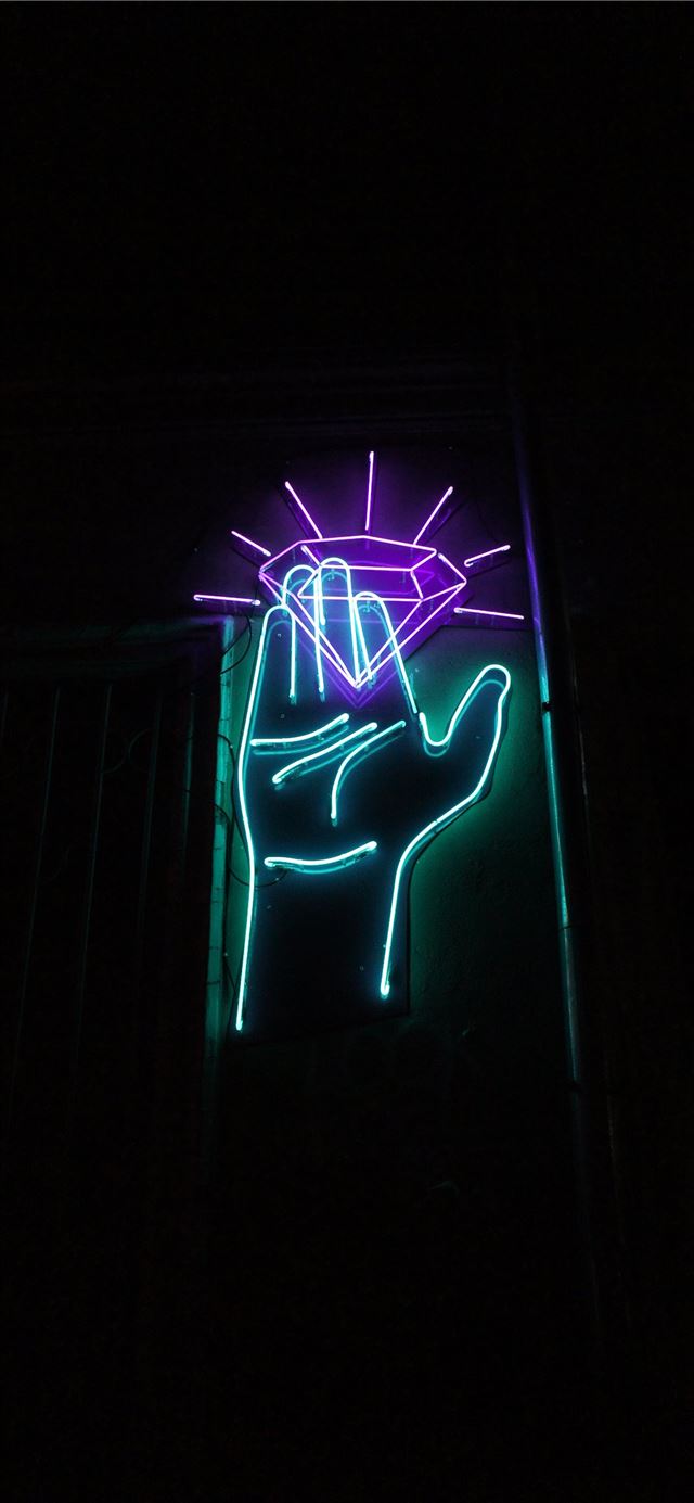1284x2778 hand and purple diamond lase lights -  iPhone 11 Wallpaper
