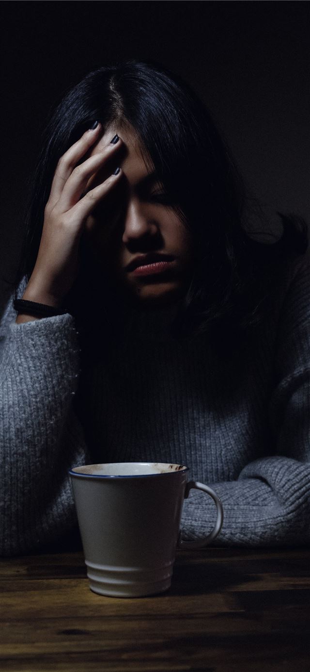 1125x2436 woman in gray sweater seating on chair -  iPhone 11 Wallpaper