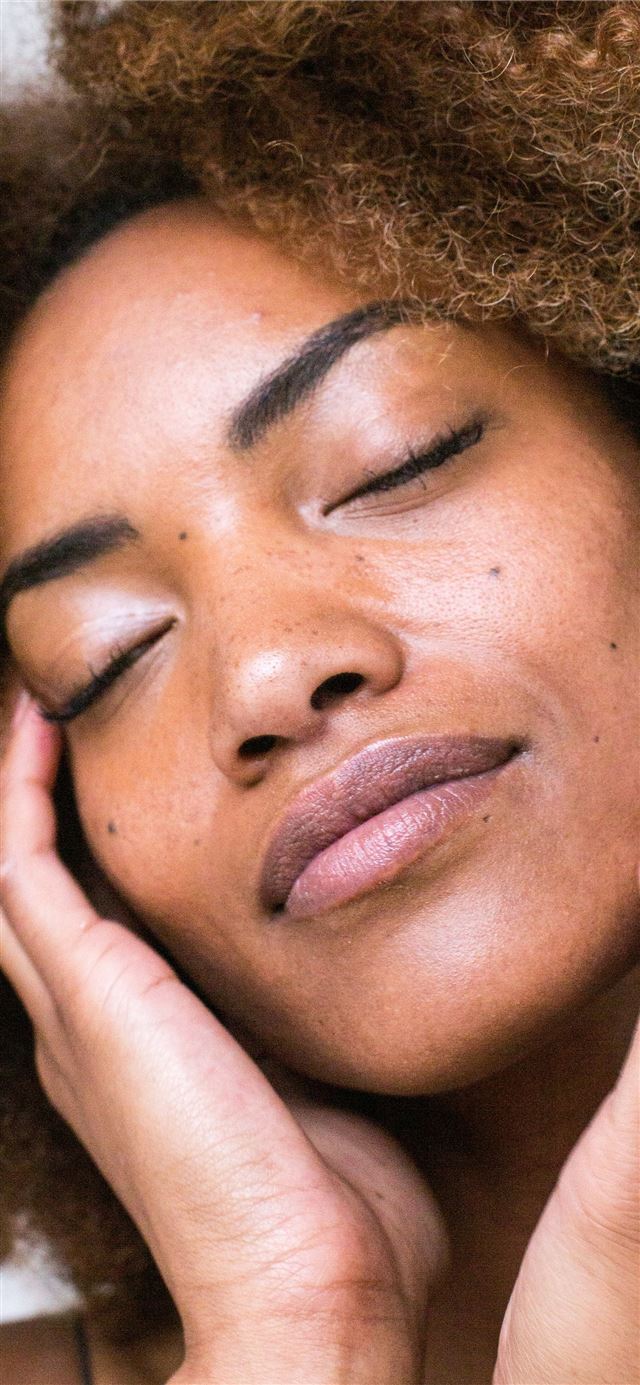 1125x2436 woman lying on brown textile -  iPhone 11 Wallpaper