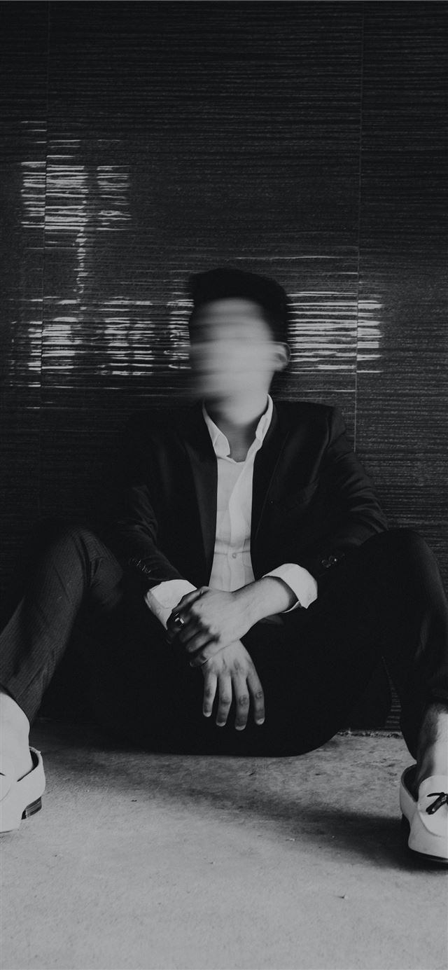 1284x2778 man sitting on floor -  iPhone 11 Wallpaper