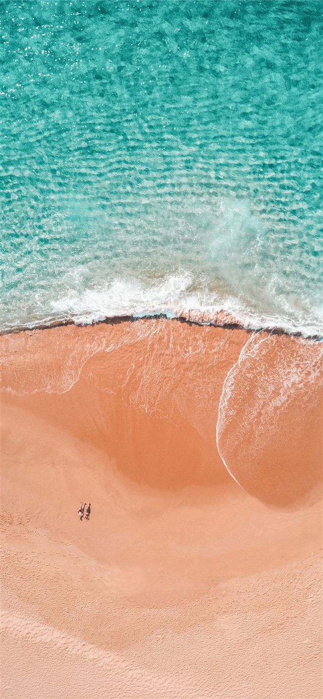 1284x2778 aerial photography of two person sunbathing on sea... -  iPhone 11 Wallpaper