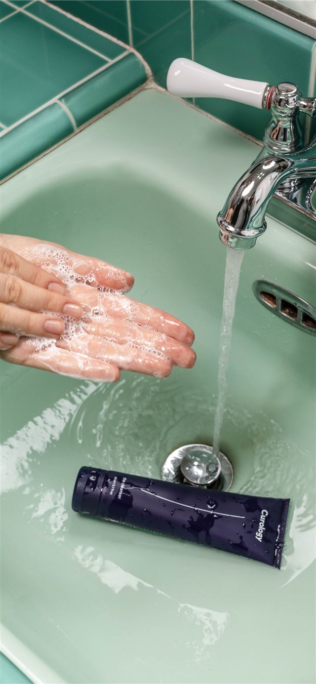 1125x2436 person washing hands on sink -  iPhone 11 Wallpaper