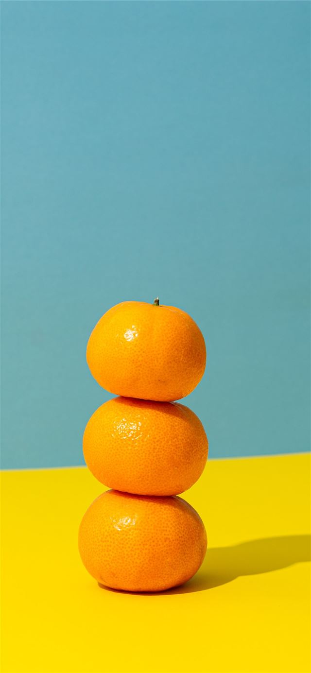 1284x2778 orange fruit on yellow surface -  iPhone 11 Wallpaper