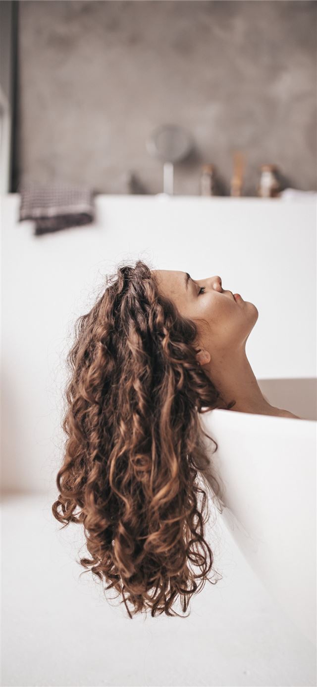 1125x2436 woman in bathtub -  iPhone 11 Wallpaper