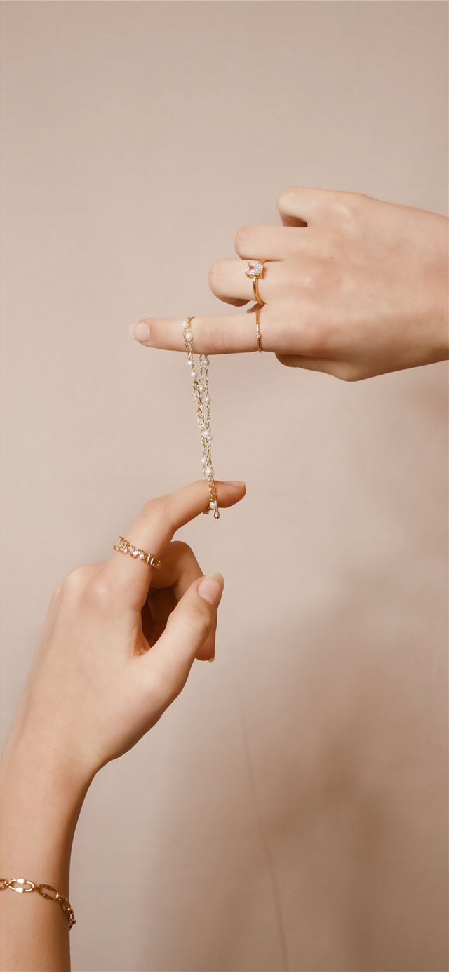 1284x2778 person holding silver chain necklace -  iPhone 11 Wallpaper