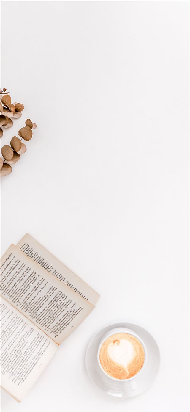 1284x2778 white ceramic mug beside white book -  iPhone 11 Wallpaper