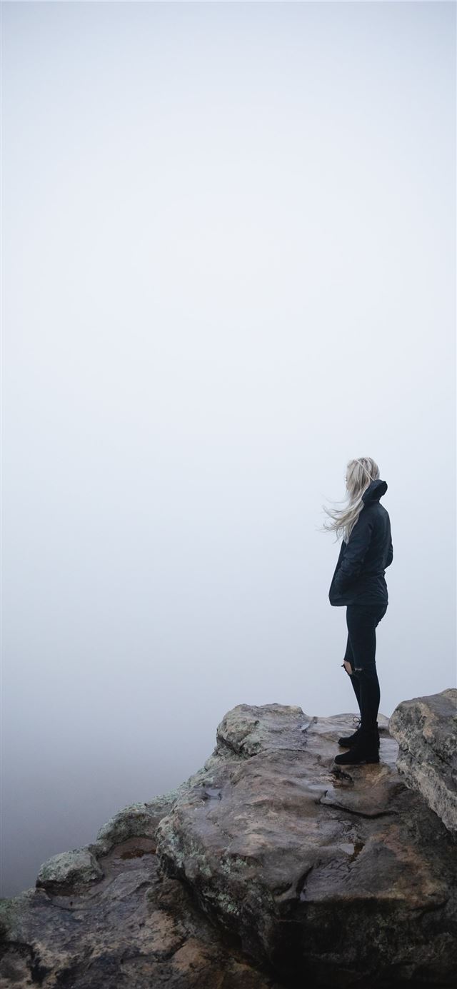 1284x2778 woman standing on cliff -  iPhone 11 Wallpaper