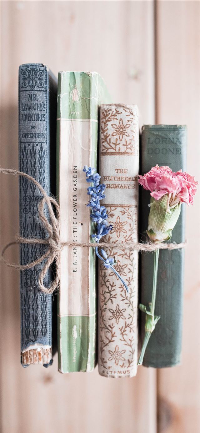 1125x2436 four assorted title books -  iPhone 11 Wallpaper