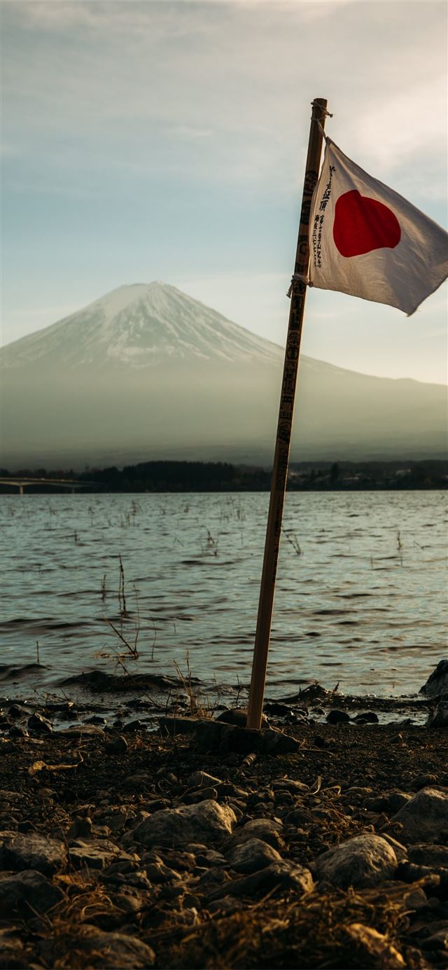 1284x2778 Japan flag mounted near on body of water -  iPhone 11 Wallpaper
