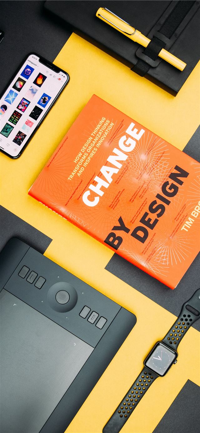 1284x2778 Change by Design by Tim Brown book beside smartpho... -  iPhone 11 Wallpaper
