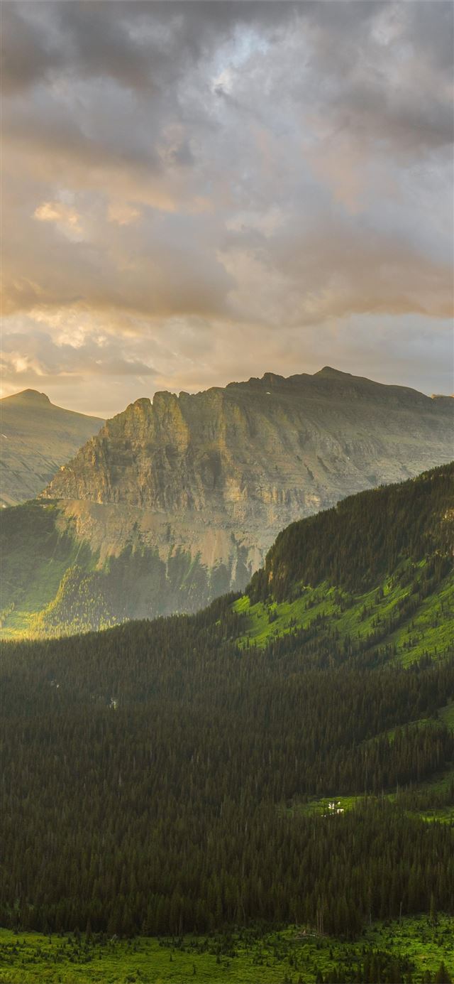1125x2436 stormy sunrise at glacier national park 8k - 4k iPhone 11 Wallpaper