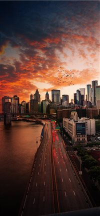 Sunset over Manhattan Bridge  iPhone 11 wallpaper