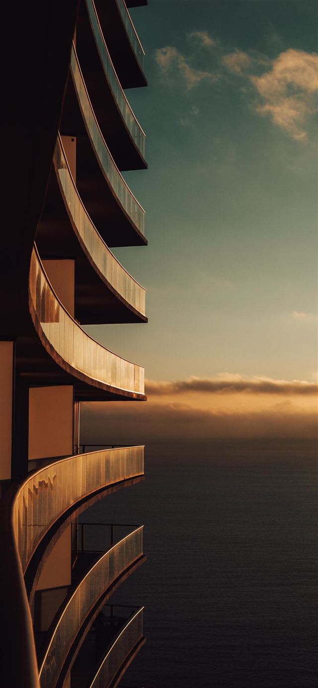 1125x2436 gray painted building and sea ocean - nature iPhone 11 Wallpaper