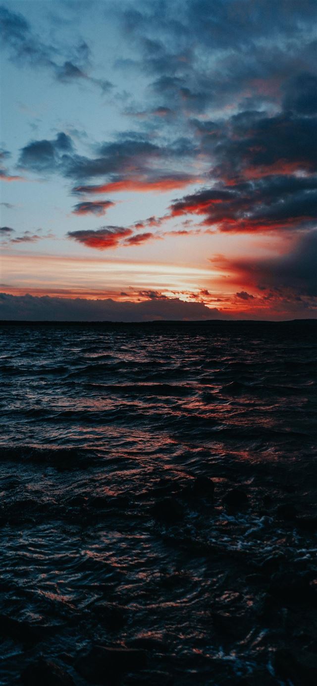 1125x2436 body of water under grey sky - sunset iPhone 11 Wallpaper