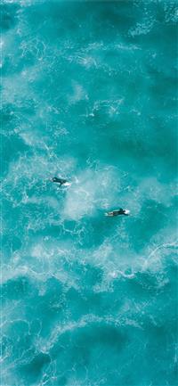 two people surfing on water iPhone 11 wallpaper