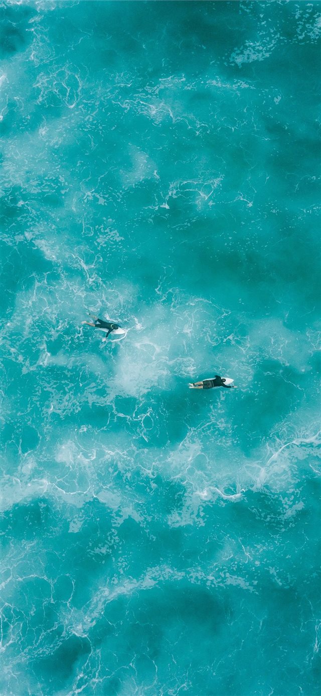 1125x2436 two people surfing on water - water iPhone 11 Wallpaper