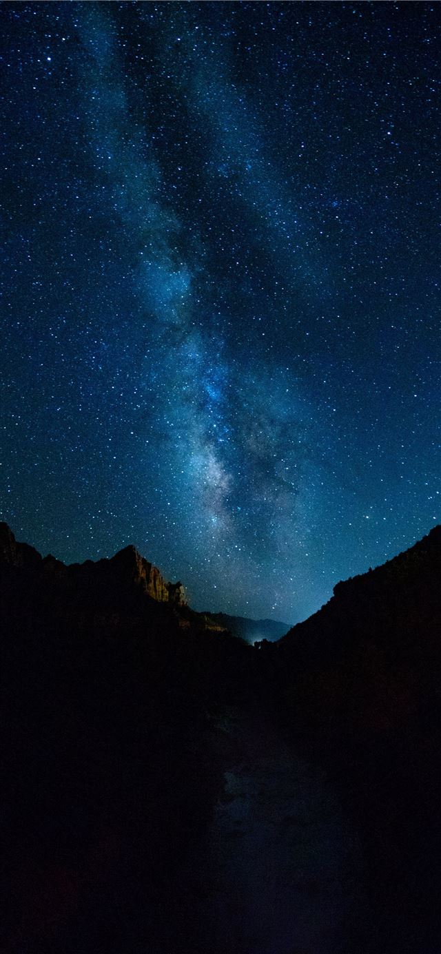 1125x2436 silhouette photography of mountain under sky - space iPhone 11 Wallpaper