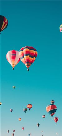assorted hot air balloons flying at high altitude ... iPhone 11 wallpaper