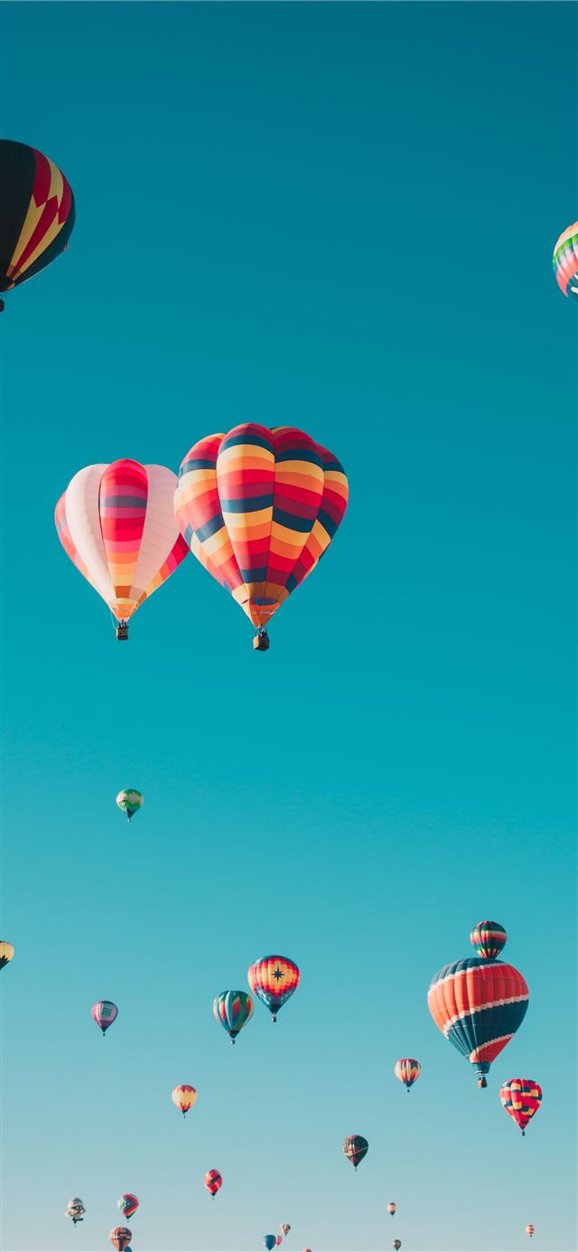 1125x2436 assorted hot air balloons flying at high altitude ... - united states iPhone 11 Wallpaper
