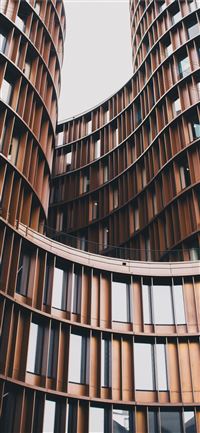 close up photography of brown concrete building wallpaper
