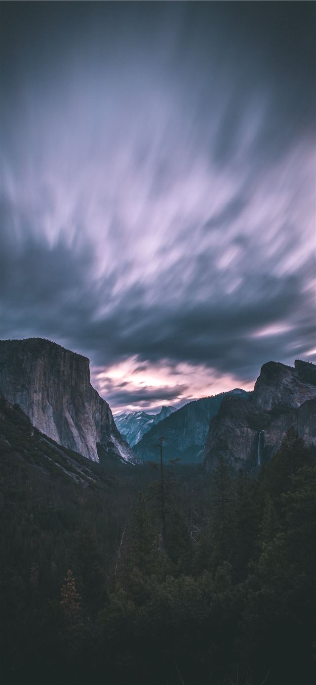 1125x2436 landscape photo of mountains under cloudy sky - grey iPhone 11 Wallpaper