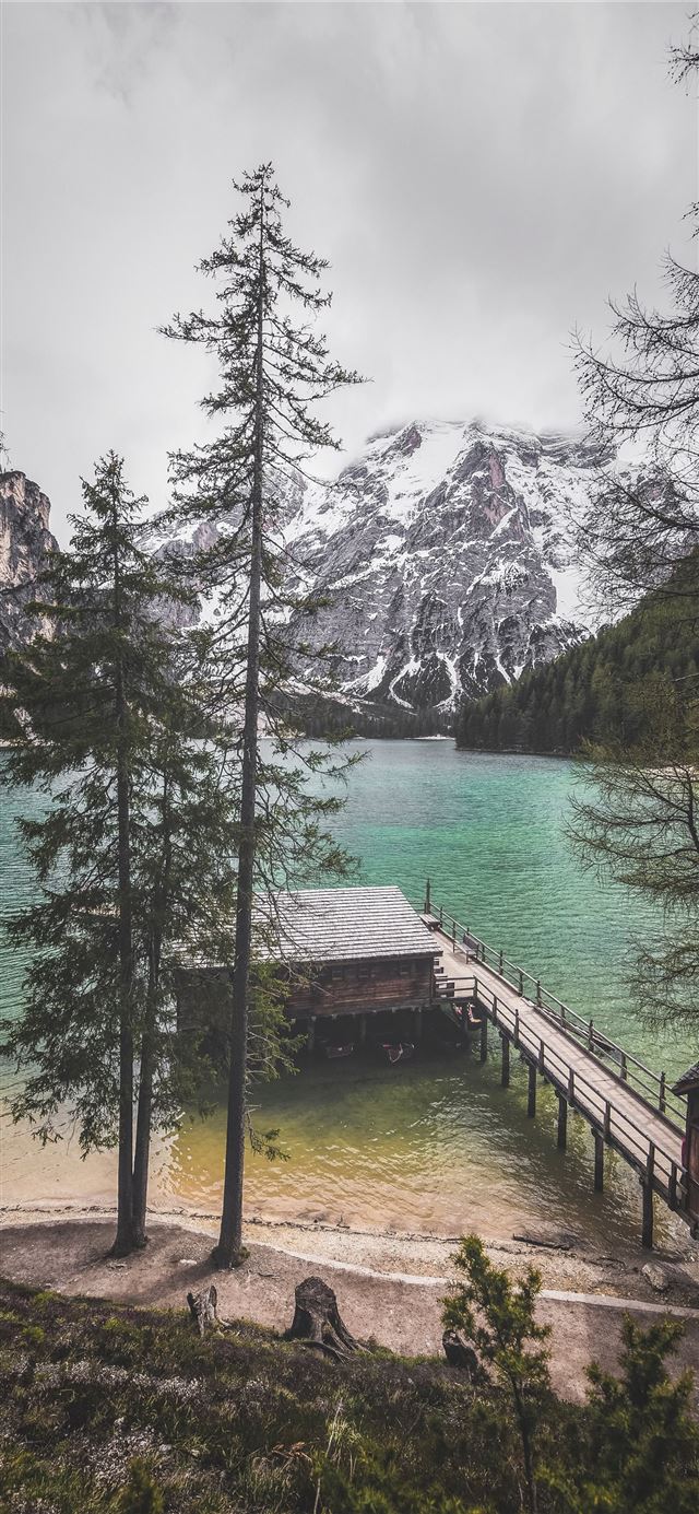 1125x2436 person standing near body of water -  iPhone 11 Wallpaper