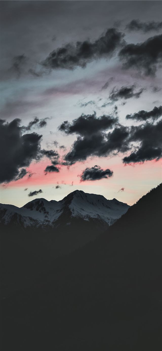 1125x2436 silhouette of mountain under cloudy sky - sunset iPhone 11 Wallpaper