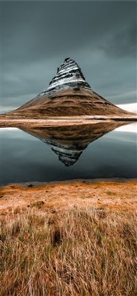 cone mountain with the distance of body of water iPhone 11 wallpaper