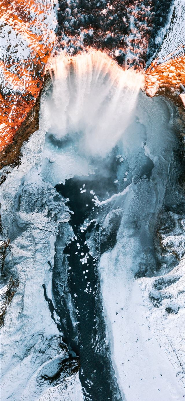 1125x2436 waterfalls in between of white rock formation - scenery iPhone 11 Wallpaper