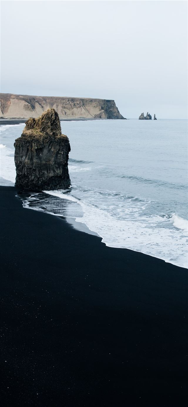 1125x2436 brown monolith rock on seashore - landscape iPhone 11 Wallpaper