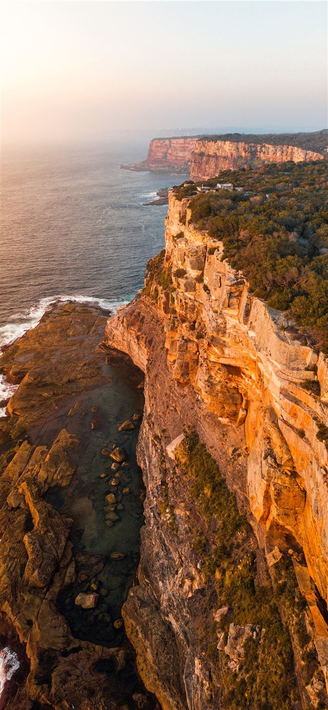 1125x2436 aerial photography of mountain beside sea - scenery iPhone 11 Wallpaper