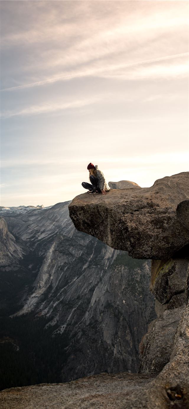 1125x2436 person sitting on brown mountain - yosemite valley iPhone 11 Wallpaper