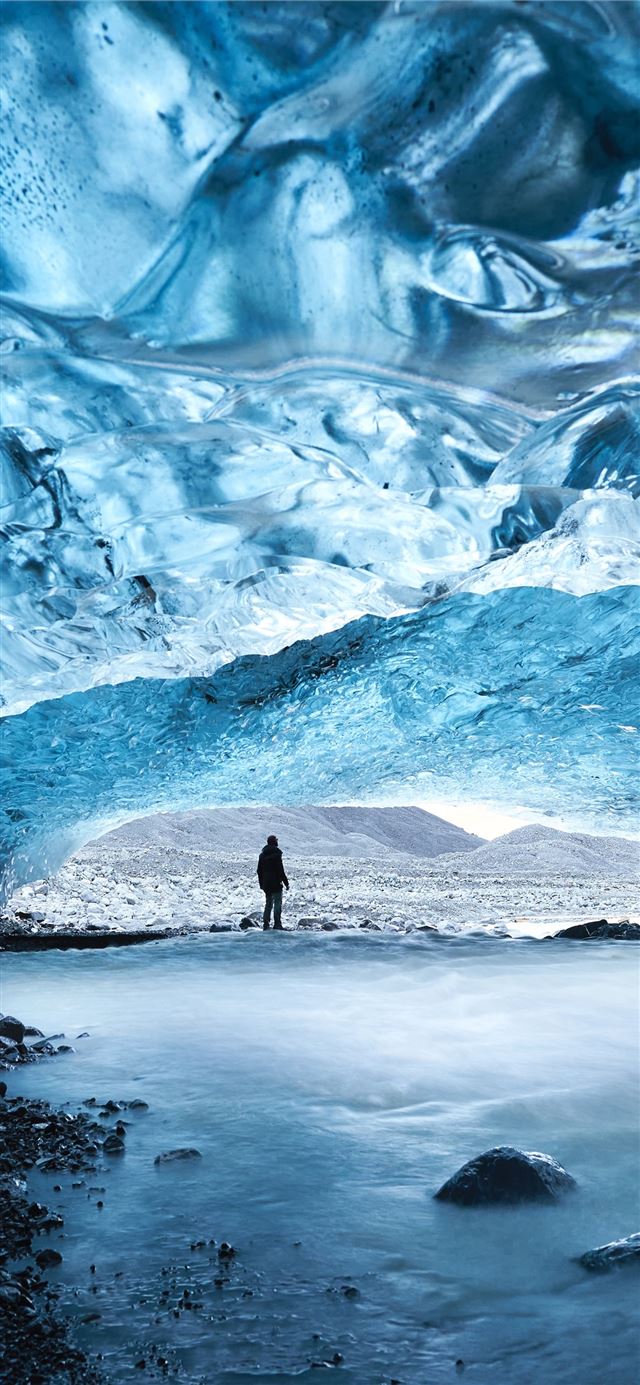 1125x2436 man under cake - iceland iPhone 11 Wallpaper
