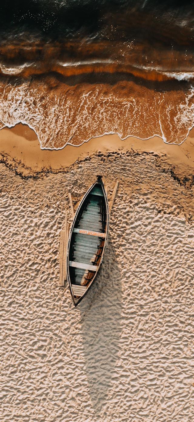 1125x2436 brown and white boat on brown sand -  iPhone 11 Wallpaper