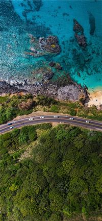 aerial view of road near body of water during dayt... iPhone 11 wallpaper