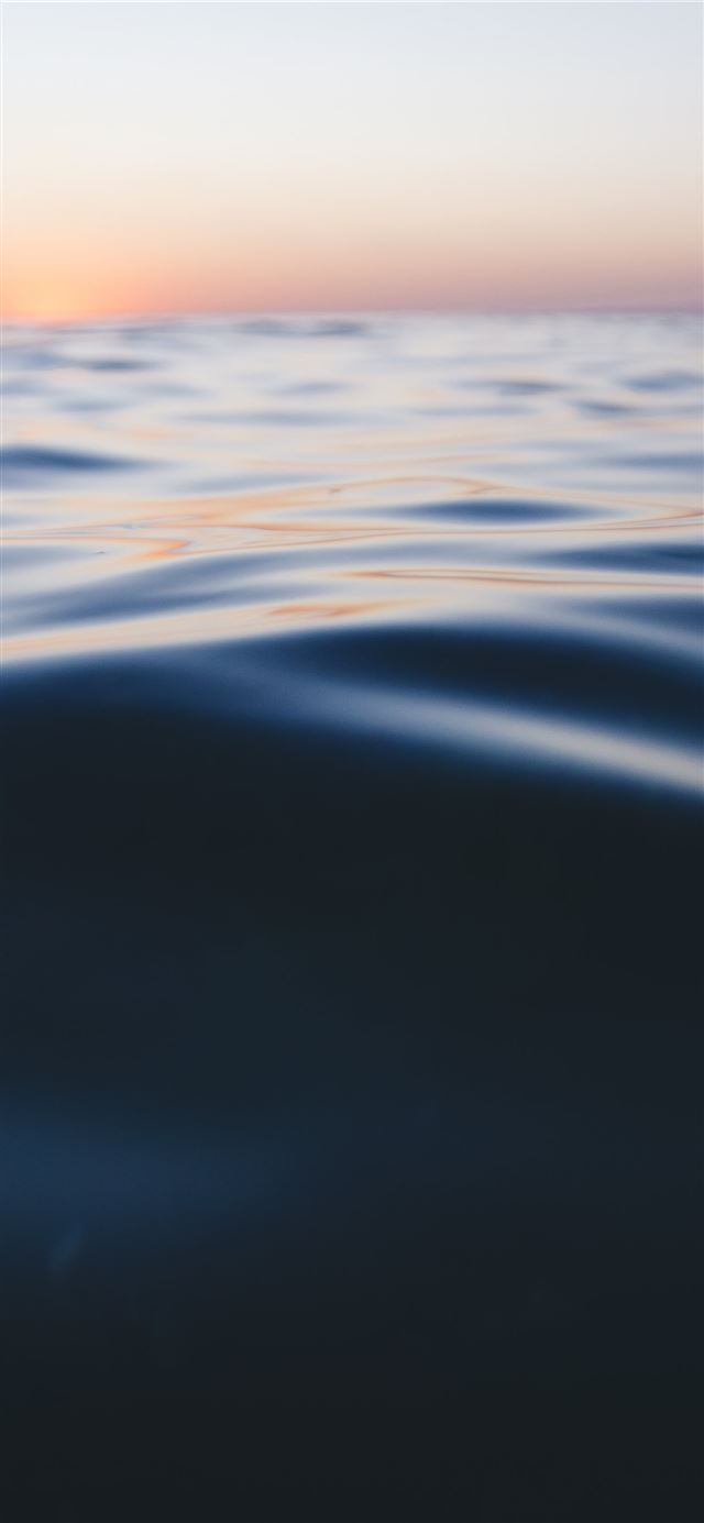 1125x2436 photo of calm sea water during daytime - sunset iPhone 11 Wallpaper