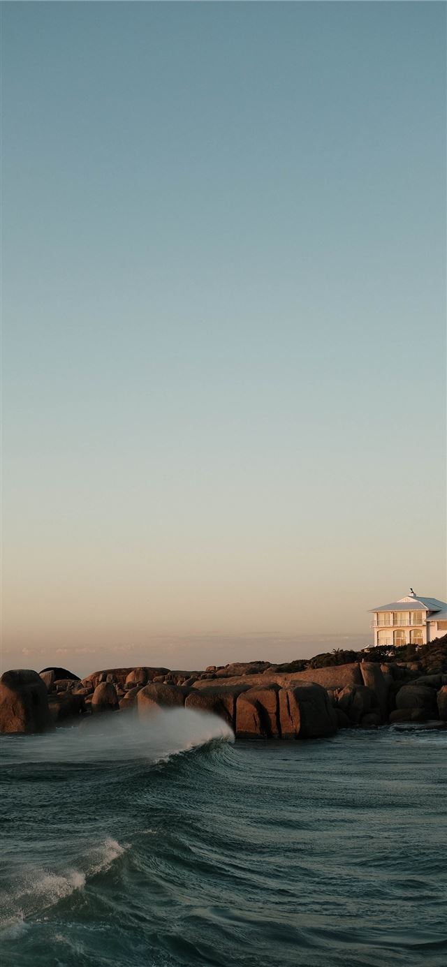 1125x2436 white and brown house on brown rock formation near... - south africa iPhone 11 Wallpaper