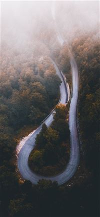 aerial photo of curved highway during daytime iPhone 11 wallpaper