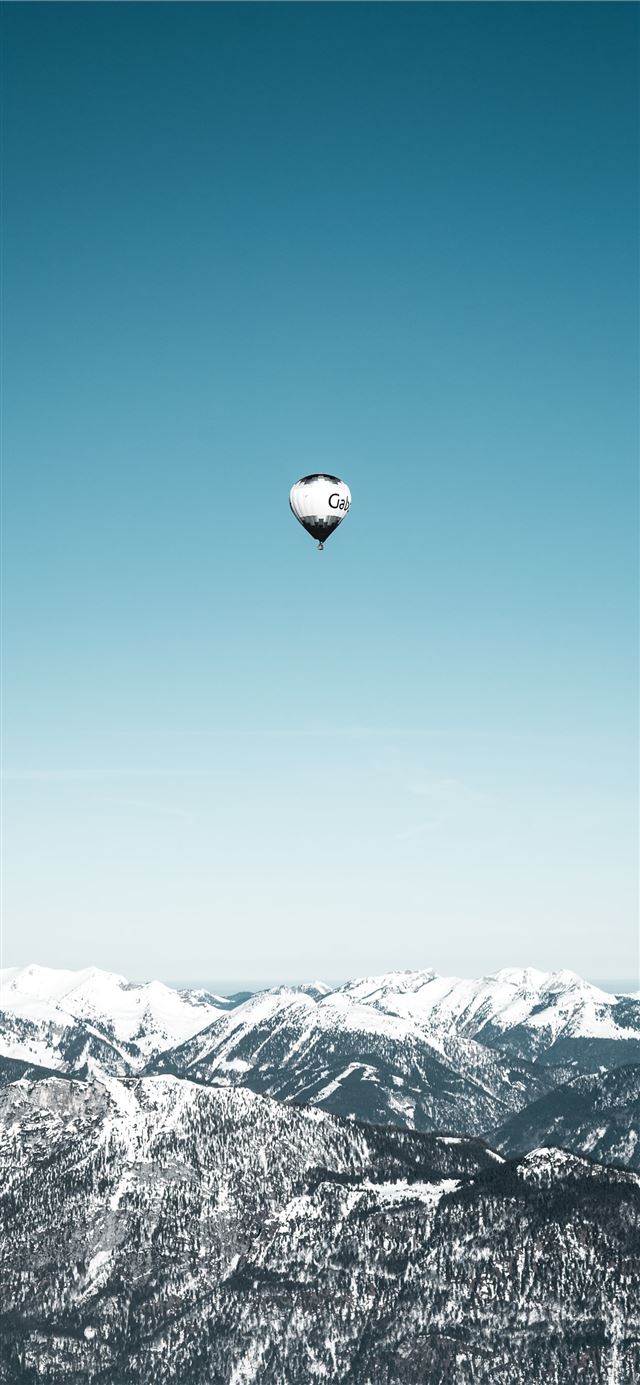 1125x2436 white and black hot air balloons in mid air - blue iPhone 11 Wallpaper