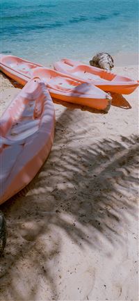 three empty kayaks wallpaper