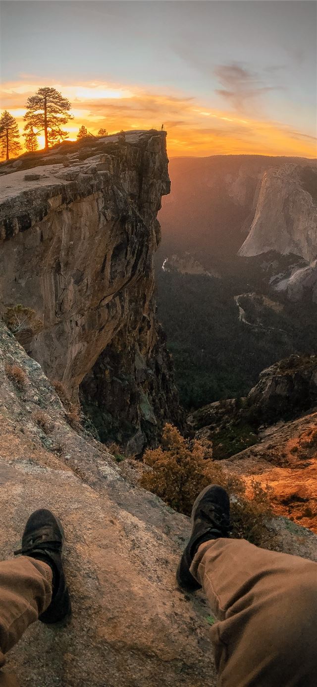 1125x2436 person pair of shoes and sitting on edge of mounta... - yosemite iPhone 11 Wallpaper