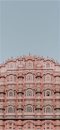 pink and white concrete structure under clear sky wallpaper