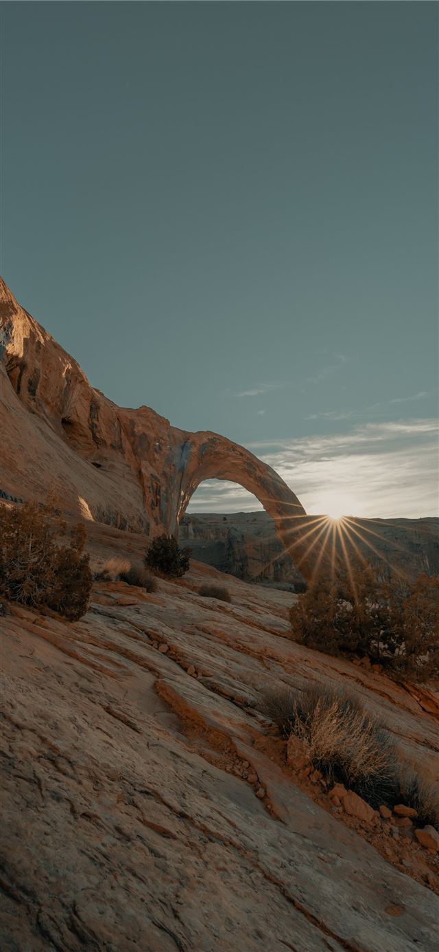 1125x2436 brown rock formation under blue sky during daytime - ut iPhone 11 Wallpaper