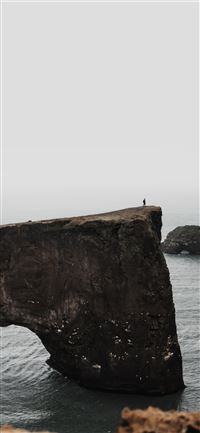 gray rock on body of water wallpaper