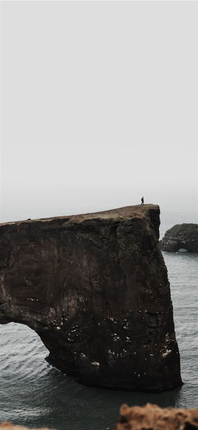 1125x2436 gray rock on body of water - ocean iPhone 11 Wallpaper
