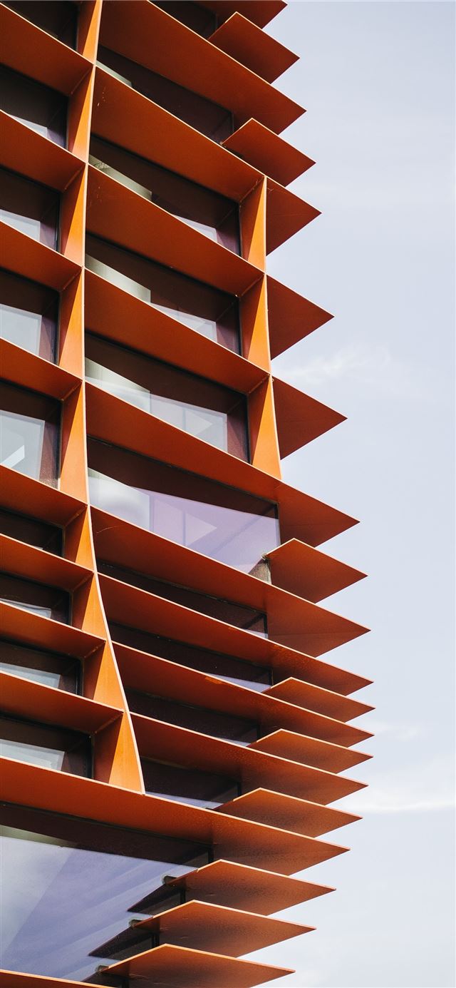 1125x2436 photo of orange painted building - brown iPhone 11 Wallpaper