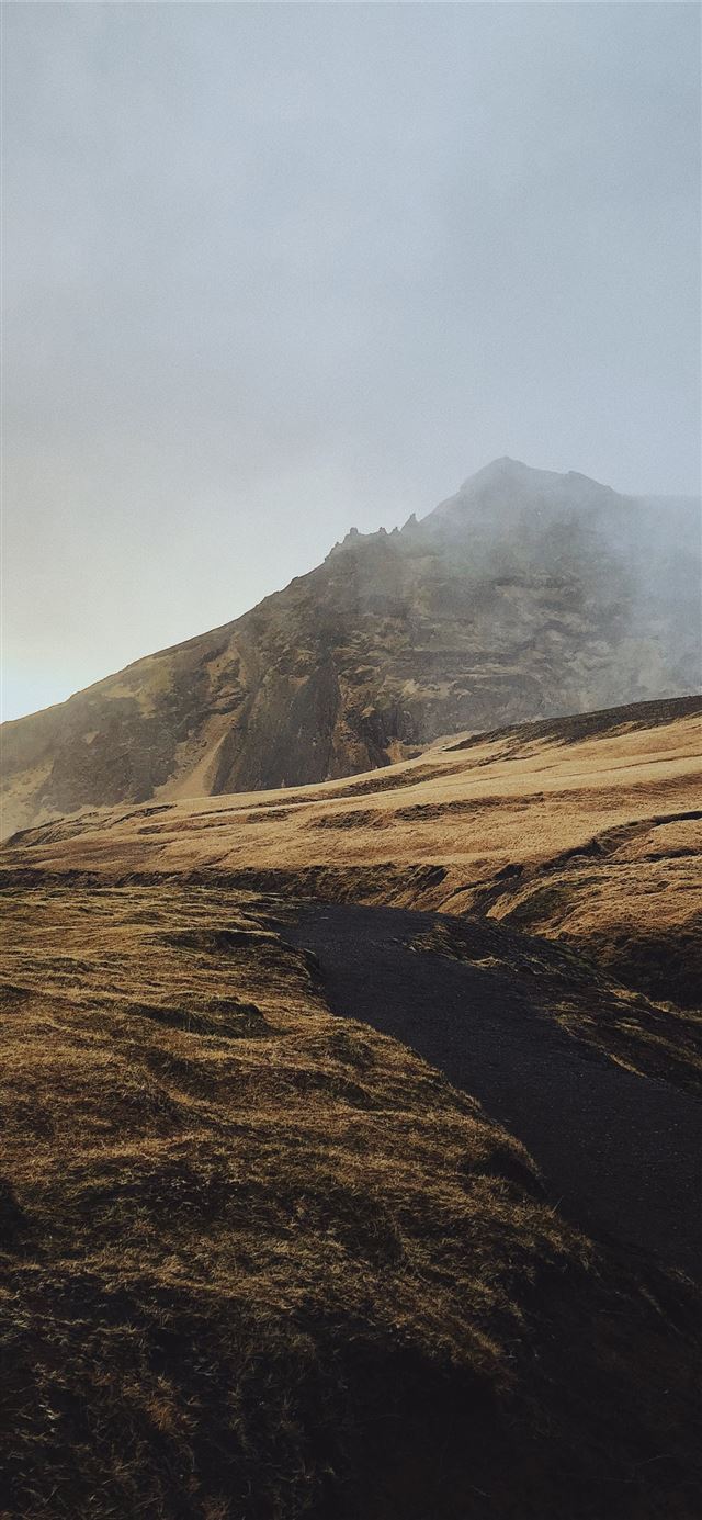 1125x2436 shallow focus photo of brown mountain - volcano iPhone 11 Wallpaper