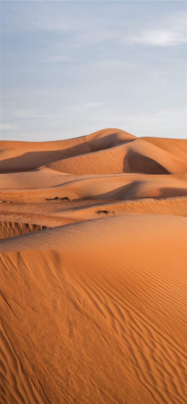 1125x2436 brown sand under blue sky during daytime - grey iPhone 11 Wallpaper