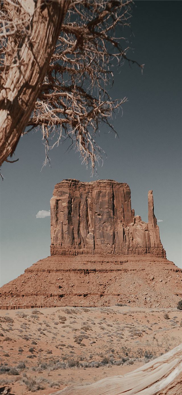 1125x2436 brown rock formation under blue sky during daytime - monument valley iPhone 11 Wallpaper